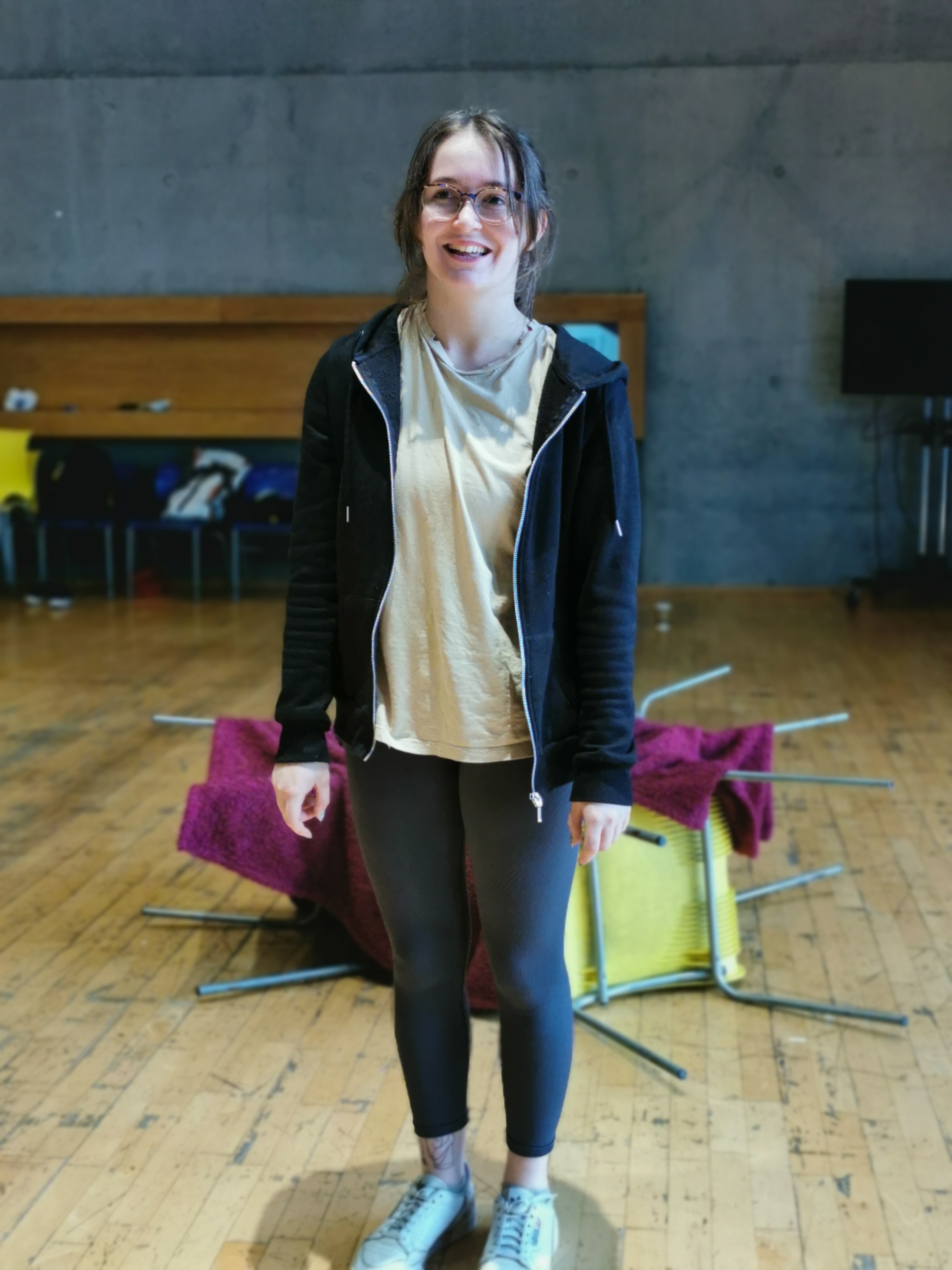 Vicky, who portrayed 'The Girl' in Tales of the Witch. She's smiling at the camera during rehearsals.